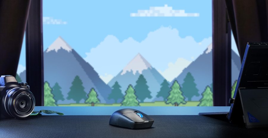 Die ROG Strix Impact III Wireless auf einem Tisch vor einem blauen Berghintergrund